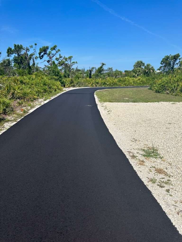 Recently asphalt paved driveway.